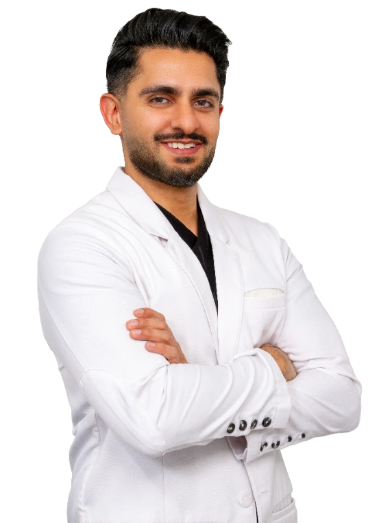 Professional headshot of Dr. Akash Mehta wearing a white lab coat, smiling at the camera against a grey background. This is a standard medical professional portrait used for clinic or practice identification.